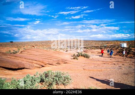 Lots of tourists during the late afternoon at Horseshoe Bend, Colorado River, Arizona, USA. Stock Photo