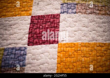 Close up of a colorful textile background with some different squares Stock Photo