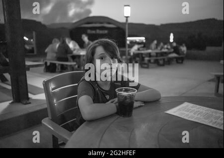 At the RIM ROCK PATIO. A spaghetti western cafe offering an eclectic blend of Italian pizza and Western BBQ with a backdrop Sergio Leone could only dream of. Capitol Reef National Park, Utah, USA Stock Photo