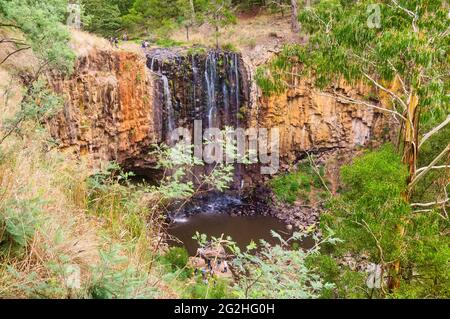 Trentham Falls is one of the longest single drop waterfalls in Victoria, plunging some 32 meters over ancient basalt columns - Trentham, Australia Stock Photo