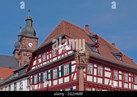 historic old town, market square, towers of the Catholic parish church St. Gangolf, half-timbered house, Marian column, baroque town Amorbach, Odenwald, Bavaria, Germany Stock Photo