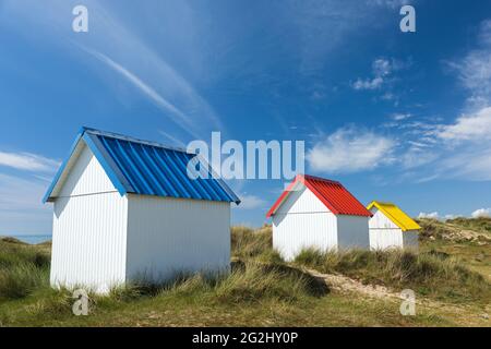 colorful beach huts in the dunes of Gouville-sur-Mer, France, Normandy, Department Manche Stock Photo