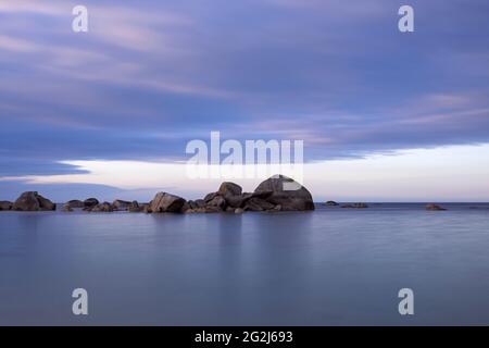 Rocks in the water, Pointe de Beg Pol, near Brignogan-Plage, evening mood, France, Brittany, Finistère department Stock Photo