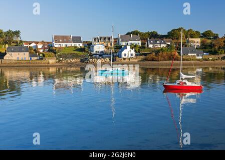 Sailboats and houses of Cosquies in the morning light, Kermorvan peninsula, view from the harbor in Le Conquet, France, Brittany, Finistère department