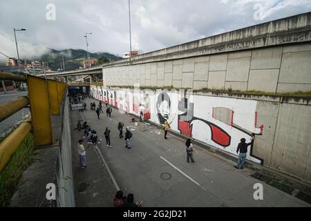 Pasto, Colombia. 11th June, 2021. Artists paint muralas in Pasto, Narino, Colombia admist anti-government protests. on June 11, 2021. Credit: Long Visual Press/Alamy Live News Stock Photo