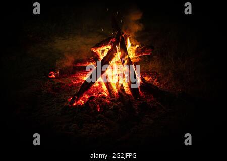 bonfire. Night campfire isolated on black. Burning logs and firewood. Bonfire At Night. Logs burning in camp fire in darkness Stock Photo