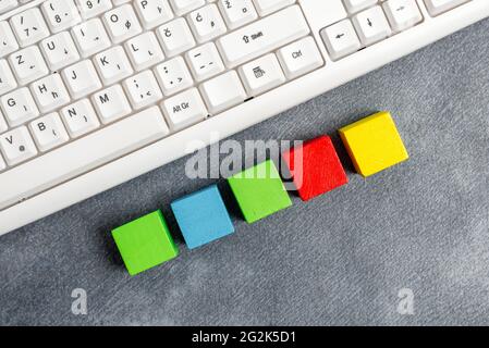 Stack of Sample Cube Rectangular Boxes On Surface Polished With Multi-Colour Stock Photo