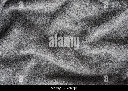 Crumpled Background Of Grey Soft Fleece Fabric Texture. Stock Photo