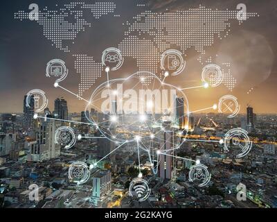 Polygonal brain shape of an artificial intelligence with various icon of smart city Internet of Things Technology over the  bangkok cityscape from top Stock Photo