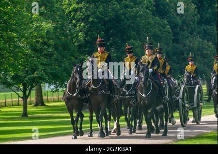 Windsor, Berkshire, UK. 12th June, 2021. The Kings’s Troop Royal Horse Artillery ride along the Long Walk today for the Trooping the Colour at Windsor Castle to celebrate Her Majesty the Queen’s official birthday. It is a scaled back version due to the Covid-19 restrictions and restrictions on mass gatherings. Credit: Maureen McLean/Alamy Live News Stock Photo