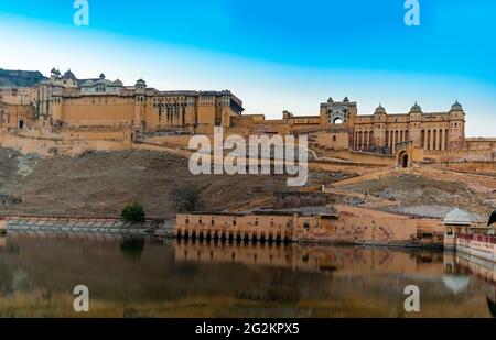 Historic Amer Fort Jaipur Rajasthan with moody sunset sky. Amber Fort is a UNESCO World Heritage site. Stock Photo