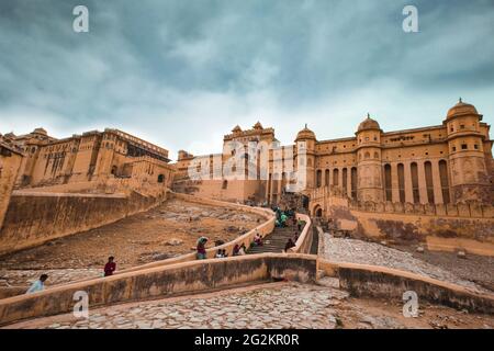 Historic Amer Fort Jaipur Rajasthan with moody sunset sky. Amber Fort is a UNESCO World Heritage site. Stock Photo