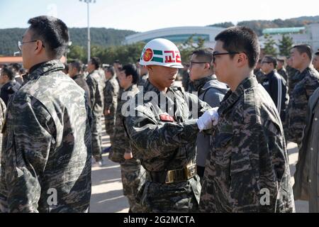 June 11, 2021-Pohang, South Korea-In this photos taken date is April 12, 2019. South Korean Marine trainees take part in an military basic boot training at Marine boot camp in Pohang, South Korea. The Republic of Korea Marine Corps also known as the ROK Marine Corps or the ROK Marines, is the marine corps of South Korea. The ROKMC is a branch of the Republic of Korea Navy responsible for amphibious operations and also functions as a rapid reaction force and a strategic reserve. The ROKMC was founded as a suppression operations force against communist partisans in 1949, prior to the Korean War. Stock Photo