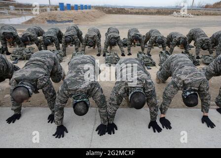 June 11, 2021-Pohang, South Korea-In this photos taken date is April 12, 2019. South Korean Marine trainees take part in an military basic boot training at Marine boot camp in Pohang, South Korea. The Republic of Korea Marine Corps also known as the ROK Marine Corps or the ROK Marines, is the marine corps of South Korea. The ROKMC is a branch of the Republic of Korea Navy responsible for amphibious operations and also functions as a rapid reaction force and a strategic reserve. The ROKMC was founded as a suppression operations force against communist partisans in 1949, prior to the Korean War. Stock Photo