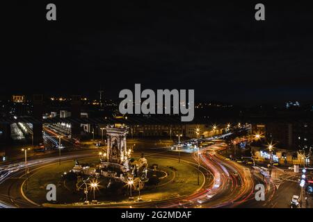 Barcelona at night with lights and vehicles Stock Photo