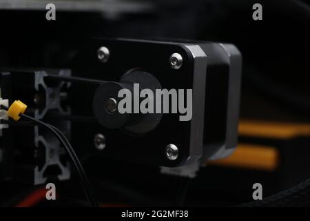 Side view of stepper motor driven heating or printing bed of three dimensional printer in short 3D Printer Stock Photo