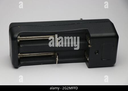 Battery charger that can charge two lithium ion batteries isolated on white background Stock Photo