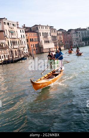 Venice, Italy - January 6 2014: Witches Rowing at Regatta of Befana in Venice, called Regata delle Befane. Members of Bucintoro Rowing Club Racing fro Stock Photo