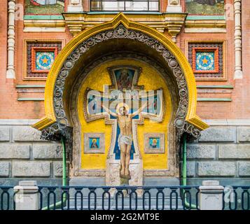 Church of the Savior on Spilled Blood, detail of the external side chapel with golden mosaic depicting Jesus Christ crucifixion, Saint Petersburg, Rus Stock Photo