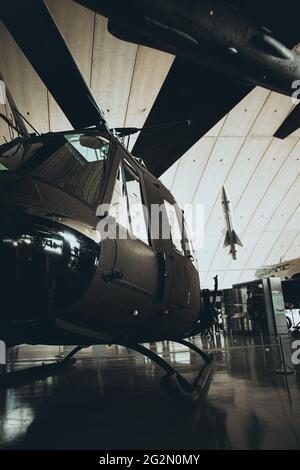 Duxford England May 2021 Vertical shot of the Huey helicopter, famous after the vietnam war. Stock Photo