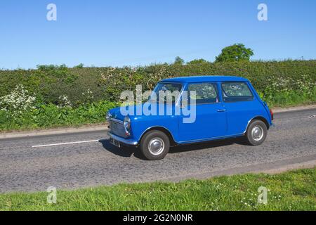1976 70s seventies Leyland cars blue Mini 850 848cc petrol 2dr, en-route to Capesthorne Hall classic May car show, Cheshire, UK Stock Photo