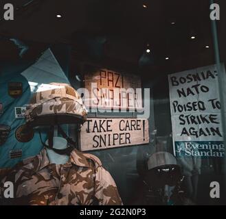 Duxford England May 2021 Exhibit of a sign saying Pazi Sniper, translated into Take Care Sniper, from the sniper alley of Sarajevo during the yugoslav Stock Photo