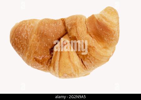 Delicious, fresh croissant on a white background from above. Croissant isolated. Stock Photo