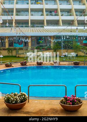 MUMBAI, INDIA - December 31, 2021: Beautifully decorated  and chair around the outdoor swimming pool in hotel and resort Stock Photo