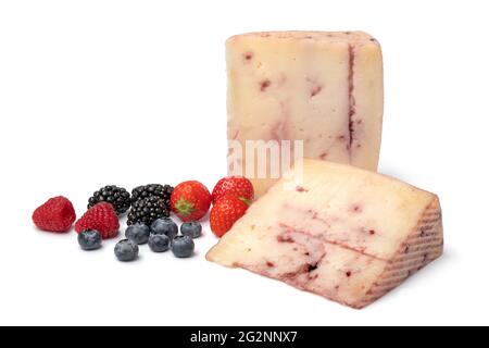 Slices of  Spanish goat cheese with red fruit syrup injected inside and fresh fruit isolated on white background Stock Photo