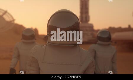 Three Astronauts in Space Suits Confidently Walking on Mars. Mars Colonization Concept. 3d rendering Stock Photo