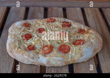 Italian bread called foccacia stuffing with cheese ham herbs and tomato Stock Photo