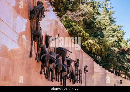 Huge bronze bas-relief, called 'El Encierro' by the Barcelona sculptor Luis Sanguino. The plaza de toros de Las Ventas, known simply as Las Ventas, is Stock Photo