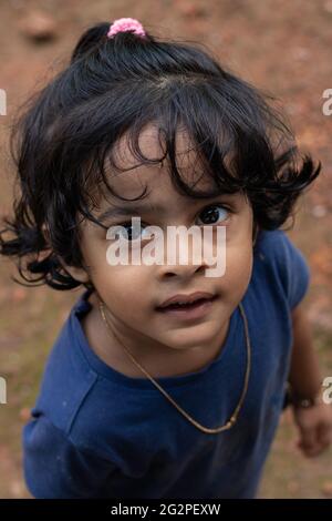 closeup of a cute little girl with a curious look on her face Stock Photo