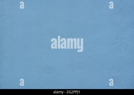 Fine plaster wall with blue paint some cracks - abstract background texture Stock Photo