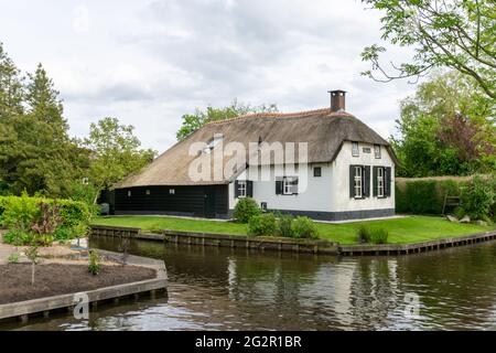 Giethoorn, Netherlands - 23 May, 2021: view of the picturesque village of Giethoorn in the Netherlands with ist quaint houses and many canals Stock Photo