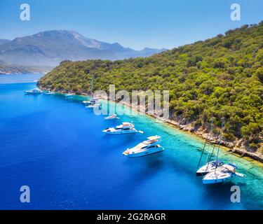 Aerial view of beautiful yachts, boats on the sea bay at sunset Stock Photo
