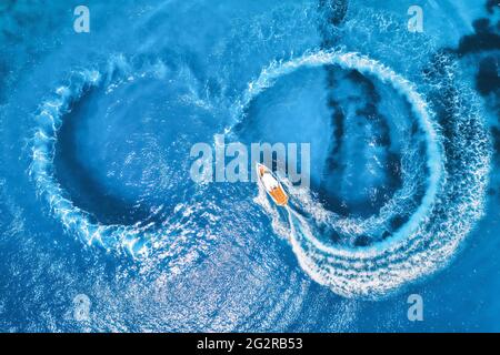 Aerial view of the speed boat in clear blue water at sunny day Stock Photo