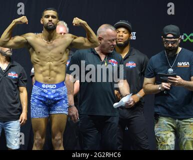 Hollywood, Florida, USA. 11th June, 2021. TikTok personality Nate Wyatt poses on the scale and Keemstar host during the LiveXLive's Social Gloves: Battle Of The Platforms Pre-Fight Weigh-In at Hard Rock Live! in the Seminole Hard Rock Hotel & Casino on June 11, 2021 in Hollywood, Florida. Credit: Mpi10/Media Punch/Alamy Live News Stock Photo