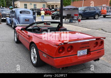 A red Corvette Convertible on display at a car show. Stock Photo