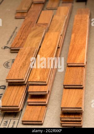 Stack of sections or planks of Brazilian Cherry exotic hardwood flooring planks ready for installation Stock Photo