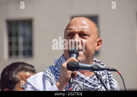 London, United Kingdom. 12th June 2021. Palestinian Ambassador to the UK Husam Zomlot speaking at the Justice For Palestine protest outside Downing Street. Thousands of people gathered to demand justice for Palestine and called on the G7 to end military cooperation with, and impose sanctions on, Israel. (Credit: Vuk Valcic / Alamy Live News). Stock Photo