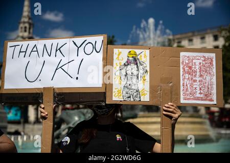 London, UK. 12th June, 2021. Pro-democracy activists hold placards during a rally in London, UK on June 12, 2021 to mark the second anniversary of the start of massive pro-democracy protests which roiled Hong Kong in 2019 Credit: May James/ZUMA Wire/Alamy Live News Stock Photo