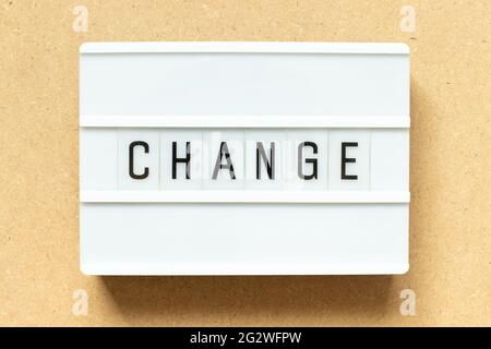 Lightbox with word change on wood background Stock Photo