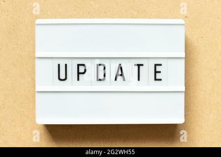 Lightbox with word update on wood background Stock Photo