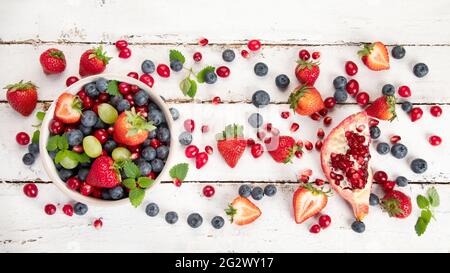 Various fresh forest berries on white background. Organic food concept. Top view Stock Photo