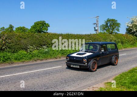 1972 70s black Reliant Rebel 700, 1839cc petrol saloon en-route to Capesthorne Hall classic May car show, Cheshire, UK Stock Photo