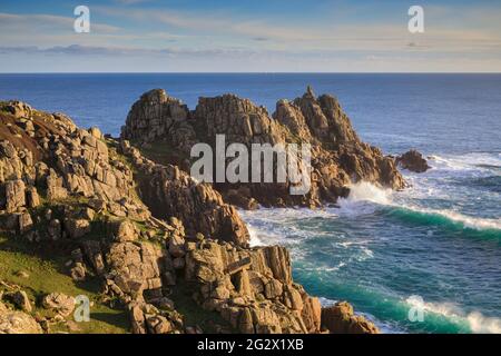 Logan Rock on the headland of Terryn Dinas near Porthcurno in Cornwall. Stock Photo