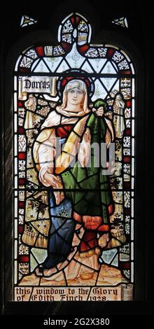 Stained Glass Window by Percy Bacon depicting Saint Dorcas, Church of the Holy Cross, Burley-on-the-Hill Stock Photo