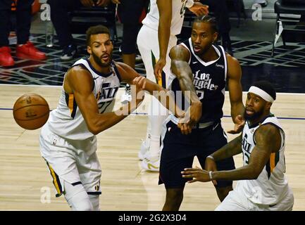 Los Angeles, Ca. 13th June, 2021. Los Angeles Clippers forward Kawhi Leoanard (2) makes the pass between two Utah Jazz defenders during the second half at Staples Center in Los Angeles on Saturday, June 12, 2021. The Clippers rallied to win another game 3, a 132-106 win over the Utah Jazz that cuts their deficit in this second-round series to 2-1 entering Monday's fourth game. Photo by Jim Ruymen/UPI Credit: UPI/Alamy Live News Stock Photo