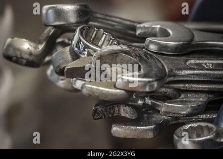 Wrenches as Mechanical Tools On Pile on Blurred Background. Natural Light Photo. Stock Photo
